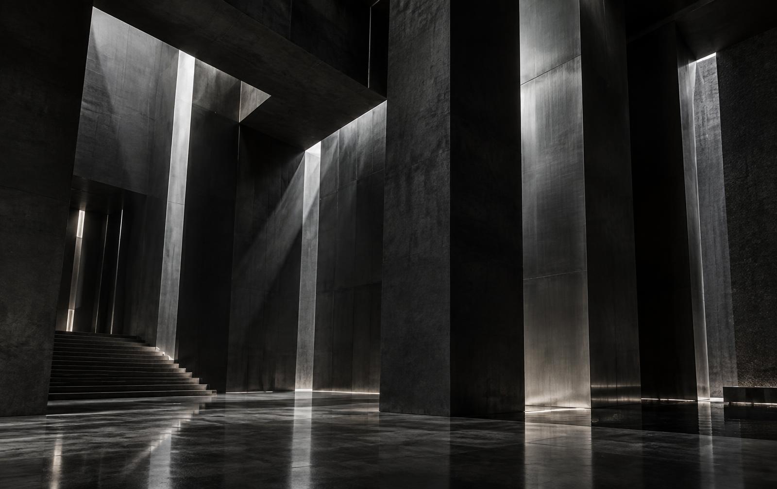 Arquitetura monumental em concreto e aço com feixes de luz